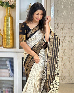 Heavy butter dola silk fabric with golden Dolby jacquard border and discharge padding leaf print