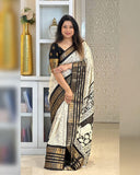 Heavy butter dola silk fabric with golden Dolby jacquard border and discharge padding leaf print