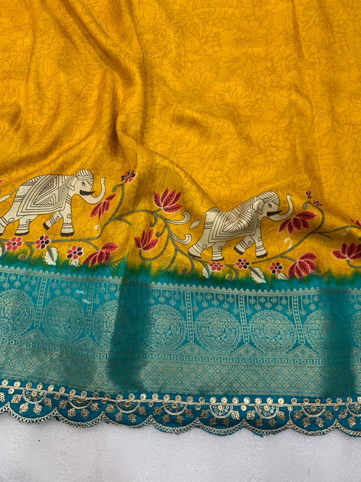 Beautiful Benny crape saree with all over kalamkari design along with scallop maggam work lace at border