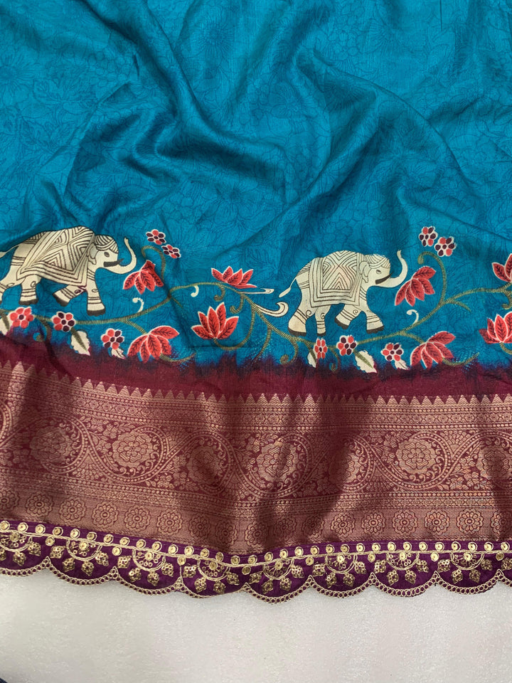 Beautiful Benny crape saree with all over kalamkari design along with scallop maggam work lace at border