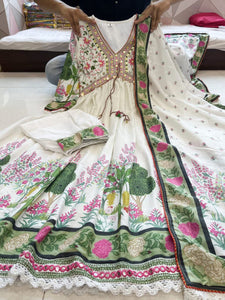 Featuring beautiful MUSLIN ALIA CUT Suit Set which is beautifully decorated with intricate hand embroidery, Zari weaving and prints. It is paired with matching pants and lace dupatta | White